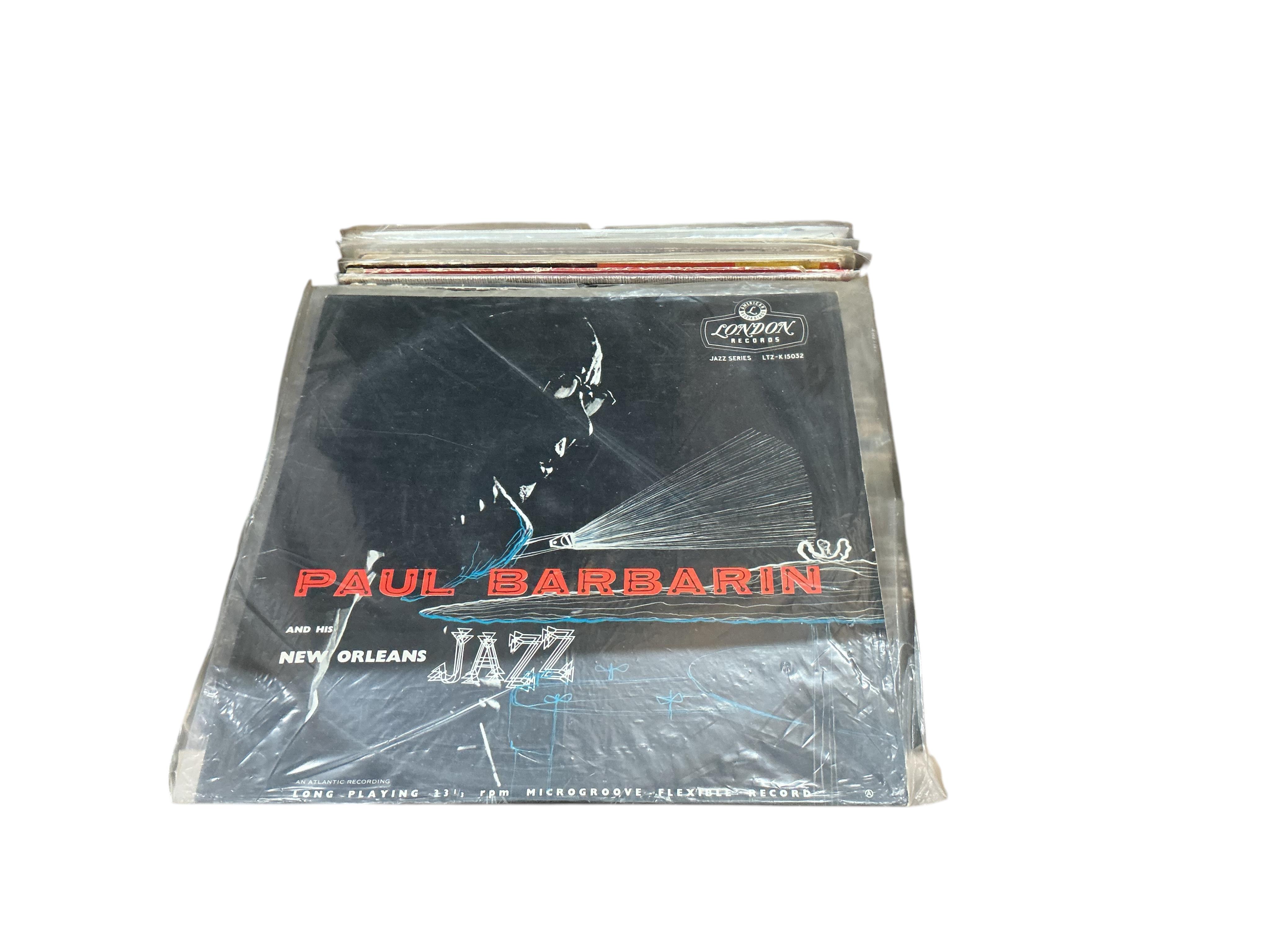 A box of jazz LP record albums, artists including; Stan Getz, Art Tatum, Dizzy Gillespie, Art Blakey, Miles Davis, Herbie Mann, etc.